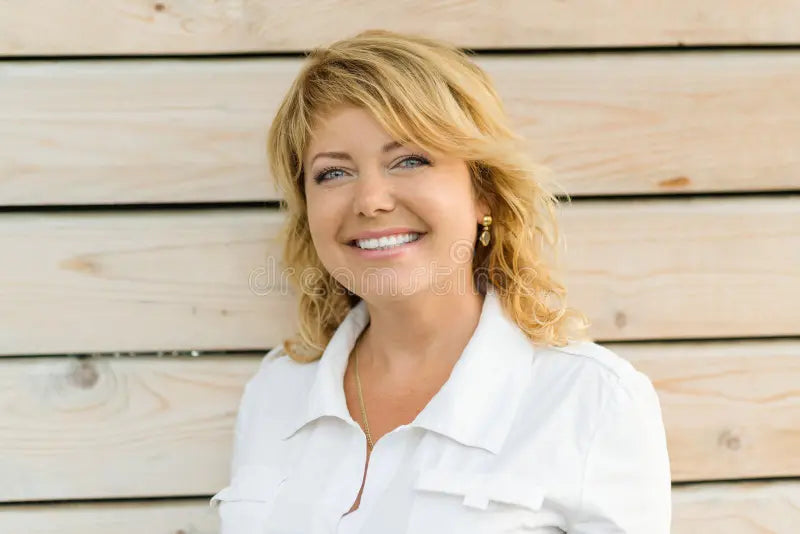 files/portrait-positive-mature-middle-aged-woman-smiling-close-up-blonde-outdoor-background-122849124.webp